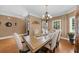 Formal dining room with crown molding, chandelier, and hardwood flooring at 3086 Frazier Walk, Decatur, GA 30033