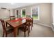 Cozy dining area with natural light and seating for six at 3086 Frazier Walk, Decatur, GA 30033