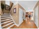 Inviting entryway showcasing hardwood floors, staircase, and neutral paint at 3086 Frazier Walk, Decatur, GA 30033