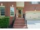 Elegant brick front entrance featuring a wooden door with glass inserts at 3086 Frazier Walk, Decatur, GA 30033