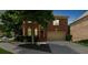 Charming brick home with a well-manicured front yard and attached two-car garage at 3086 Frazier Walk, Decatur, GA 30033