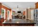 Open kitchen island view into the living room with bright accents and stainless steel refrigerator at 3086 Frazier Walk, Decatur, GA 30033