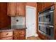 Shot of the stainless steel oven and microwave in a large kitchen with stainless steel appliances and wood cabinets at 3086 Frazier Walk, Decatur, GA 30033