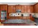 Gourmet kitchen island, stainless steel appliances, ample counter space and a stylish tile backsplash at 3086 Frazier Walk, Decatur, GA 30033