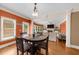 Open-concept living and dining area with hardwood floors and large windows at 3086 Frazier Walk, Decatur, GA 30033