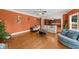 Open-concept living room with hardwood floors and view into the kitchen at 3086 Frazier Walk, Decatur, GA 30033