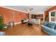 Cozy living room boasts hardwood floors, modern sofas, and a view into the open-concept kitchen at 3086 Frazier Walk, Decatur, GA 30033