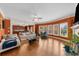 Bright living room features hardwood floors, a ceiling fan, and large windows offering natural light at 3086 Frazier Walk, Decatur, GA 30033