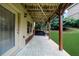 Inviting covered patio area for outdoor living with a sliding door and access to greenery at 3086 Frazier Walk, Decatur, GA 30033