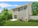 Cozy home featuring a well-maintained backyard with a patio and green lawn at 3454 Carriage Chase Rd, Atlanta, GA 30349