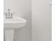 White pedestal sink and chrome faucet at 3454 Carriage Chase Rd, Atlanta, GA 30349