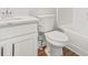 White toilet, sink, and bathtub in a clean and simple bathroom design at 3454 Carriage Chase Rd, Atlanta, GA 30349
