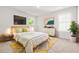 Bright bedroom with neutral walls, plush carpet, and stylish furniture, creating a warm and inviting space at 3454 Carriage Chase Rd, Atlanta, GA 30349