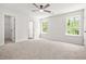 Spacious bedroom offers lots of natural light and neutral carpet at 3454 Carriage Chase Rd, Atlanta, GA 30349