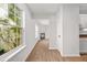 Bright living room features hardwood floors, a cozy fireplace, and large windows for natural light at 3454 Carriage Chase Rd, Atlanta, GA 30349