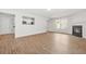 Spacious living room with hardwood floors and a fireplace with an open view to the kitchen at 3454 Carriage Chase Rd, Atlanta, GA 30349