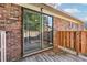 Wooden back deck with natural wood fencing and brick siding at 5560 Kingsport Ne Dr # 27, Atlanta, GA 30342