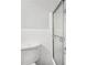 Close up of a toilet and shower/tub combo with a sliding glass door in a bathroom at 5560 Kingsport Ne Dr # 27, Atlanta, GA 30342