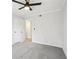 Bedroom featuring neutral walls, carpet, a ceiling fan, and doors to the hall and closet at 5560 Kingsport Ne Dr # 27, Atlanta, GA 30342