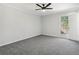 Bedroom featuring neutral walls, carpet, a ceiling fan, and a door to the exterior of the home at 5560 Kingsport Ne Dr # 27, Atlanta, GA 30342