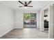 Dining area with ceiling fan, wood-look flooring, patio access, and view of the kitchen at 5560 Kingsport Ne Dr # 27, Atlanta, GA 30342