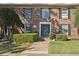 Charming brick apartment building featuring a manicured lawn and inviting front entrance at 5560 Kingsport Ne Dr # 27, Atlanta, GA 30342