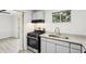 Cozy kitchen with stainless appliances, stone counters, and adjoining dining area at 5560 Kingsport Ne Dr # 27, Atlanta, GA 30342