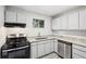 Bright kitchen featuring stainless steel appliances, granite counters, and crisp white cabinetry at 5560 Kingsport Ne Dr # 27, Atlanta, GA 30342
