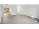 Light-filled living area with patio access and neutral walls with wood-look flooring at 5560 Kingsport Ne Dr # 27, Atlanta, GA 30342