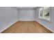 The bedroom features hardwood floors, large window, with custom geometric wall design at 1585 Melanie Ct, Decatur, GA 30032