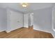 Bedroom featuring neutral walls, wood floors and a closet space for storage at 1585 Melanie Ct, Decatur, GA 30032