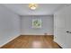 Bedroom showcasing neutral walls, wood floors and a window with bright natural light at 1585 Melanie Ct, Decatur, GA 30032