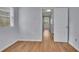 Bedroom features hardwood floors, natural light from the window, and neutral paint at 1585 Melanie Ct, Decatur, GA 30032