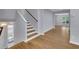 Inviting entryway with hardwood floors, a staircase, and a view into the living space at 1585 Melanie Ct, Decatur, GA 30032