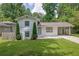Charming home with lush green lawn and landscaping at 1585 Melanie Ct, Decatur, GA 30032