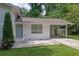 Charming home with a long driveway and landscaping at 1585 Melanie Ct, Decatur, GA 30032