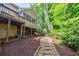 Landscaped backyard featuring a stone walkway and lush greenery, perfect for outdoor relaxation at 3620 Chartwell Dr, Suwanee, GA 30024