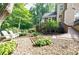 Inviting backyard featuring a wooden walkway, beautiful landscaping, and comfortable seating for outdoor enjoyment at 3620 Chartwell Dr, Suwanee, GA 30024