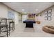 Spacious basement with a pool table, carpet flooring, and ample space for entertaining at 3620 Chartwell Dr, Suwanee, GA 30024