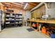 Unfinished basement with workbench, shelves, and exposed insulation at 3620 Chartwell Dr, Suwanee, GA 30024