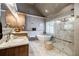 Luxurious primary bathroom with a soaking tub, glass shower, and vanity at 3620 Chartwell Dr, Suwanee, GA 30024