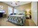 Serene bedroom with blue accents, carpet, dedicated workspace, closet, and natural light from a window at 3620 Chartwell Dr, Suwanee, GA 30024