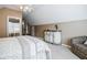 View of a bedroom showcasing carpet floors, styled furniture, ceiling fan, and natural light from a window at 3620 Chartwell Dr, Suwanee, GA 30024