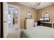 Bedroom with carpet, dedicated workspace, and view into the hallway with multiple rooms at 3620 Chartwell Dr, Suwanee, GA 30024