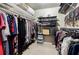 Walk-in closet with ample hanging space, shelving, and organizers at 3620 Chartwell Dr, Suwanee, GA 30024