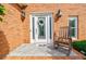 Charming front entrance with decorative wreath and classic rocking chair at 3620 Chartwell Dr, Suwanee, GA 30024