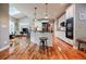 Well-lit kitchen featuring a center island with seating, stainless steel appliances, and open layout at 3620 Chartwell Dr, Suwanee, GA 30024