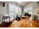 Bright living area with soaring ceilings, skylight, shutters, and beautiful hardwood floors, creating a serene atmosphere at 3620 Chartwell Dr, Suwanee, GA 30024