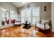 Inviting sunroom featuring plantation shutters, skylights, ample seating, and a view of the lush greenery at 3620 Chartwell Dr, Suwanee, GA 30024