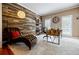 Comfortable home office featuring a stylish chaise lounge, wood accent wall, and ample natural light at 3620 Chartwell Dr, Suwanee, GA 30024